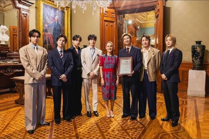 A picture of the BTS band at the Mexican presidential palace